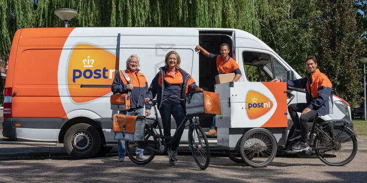 PostNL delivery team with electric cargo bikes and van for last-mile delivery.