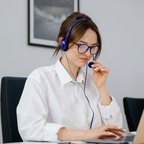 Account manager wearing headset