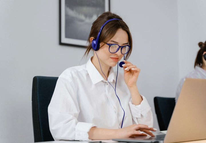 Account manager wearing headset
