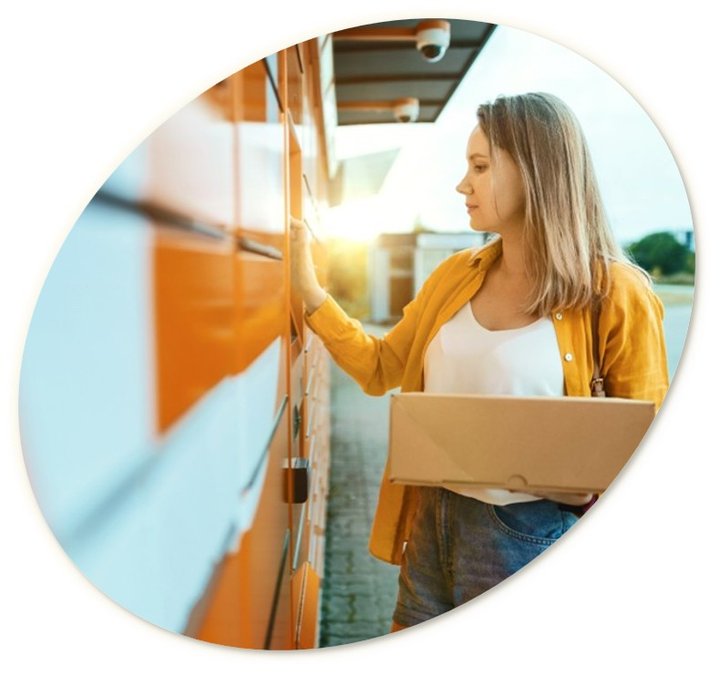 Woman collecting a parcel from a parcel locker.