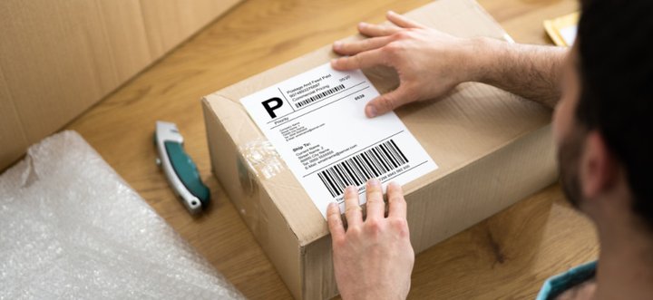 Shipping label applied to parcel for WooCommerce order fulfilment
