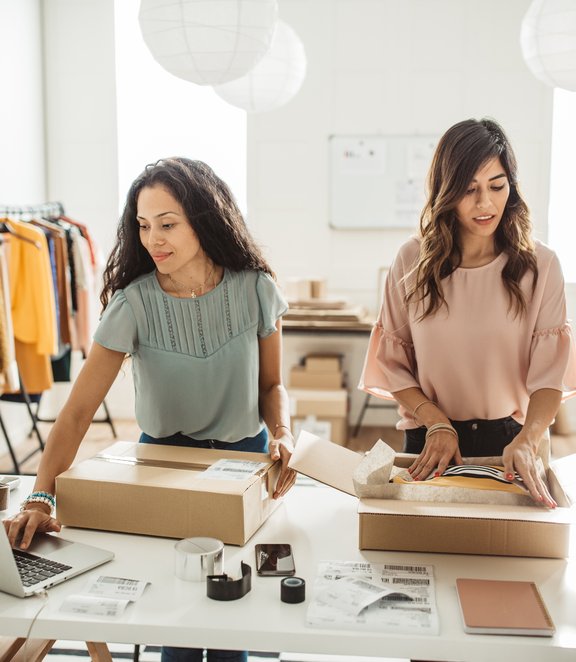 Fashion shop owners preparing an order