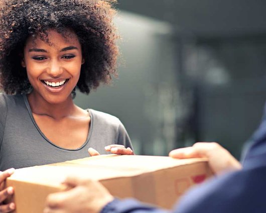 happy woman accepting a package