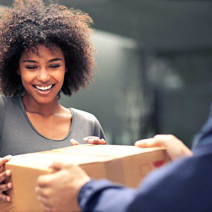 happy woman receiving a package