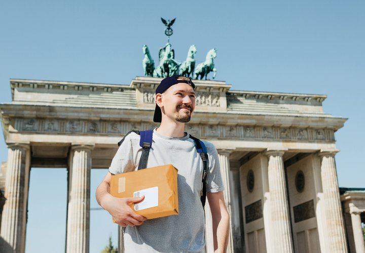 Man in germany holding parcel