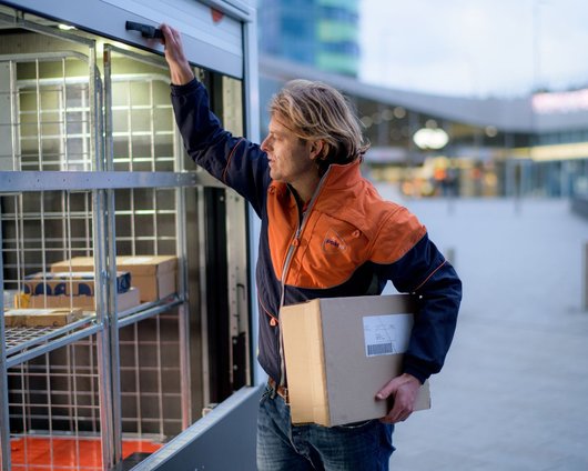 PostNL working unloading truck