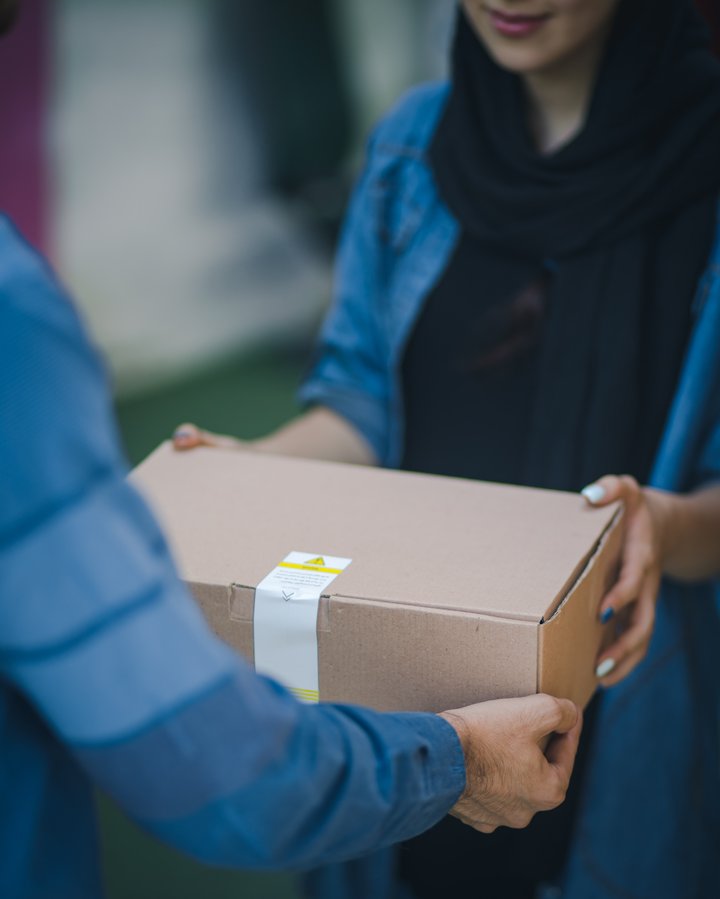 Parcel being handed to a recipient