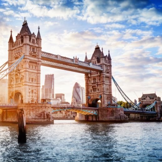 View of the UK Tower Bridge in London, with a bright blue sky and some sun