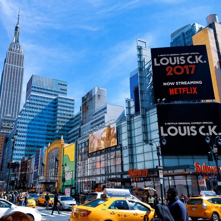 New york city street with yellow taxi and subway entrance
